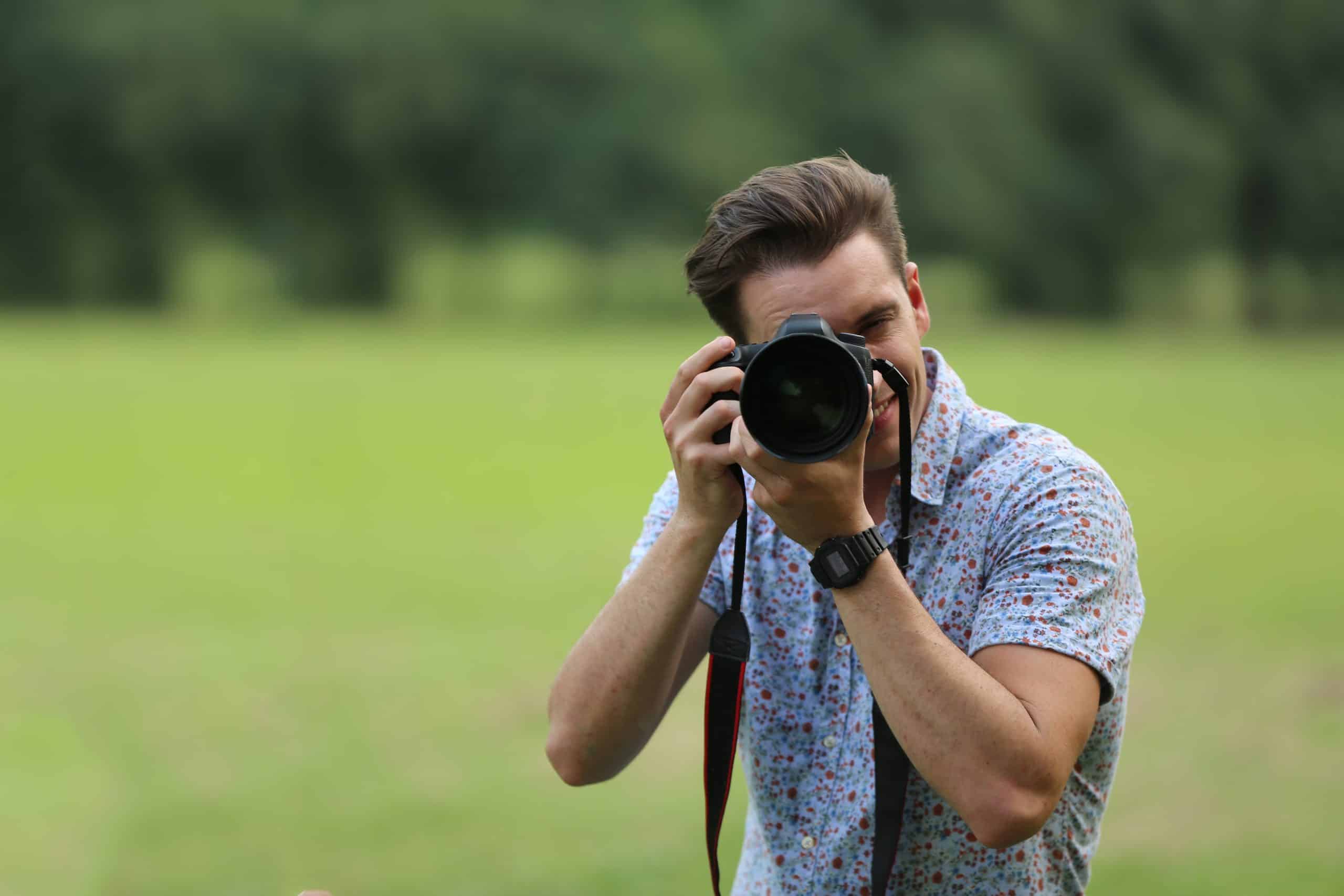 expert-in-photography-2022-05-19-15-16-37-utc » Advent Trinity Marketing Agency man holding a camera working on his photography outside