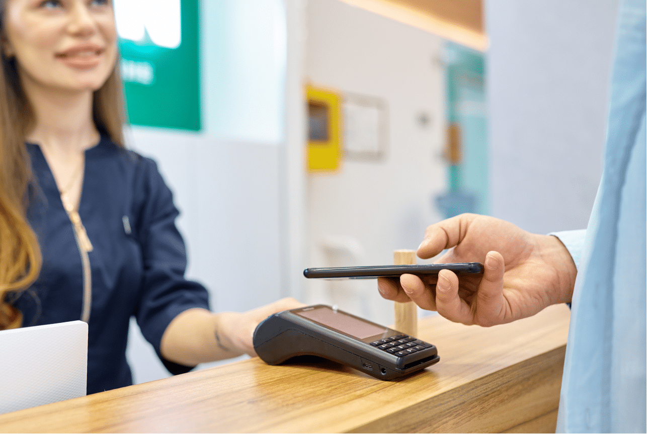 smiling woman using contactless pay example of Google PPC