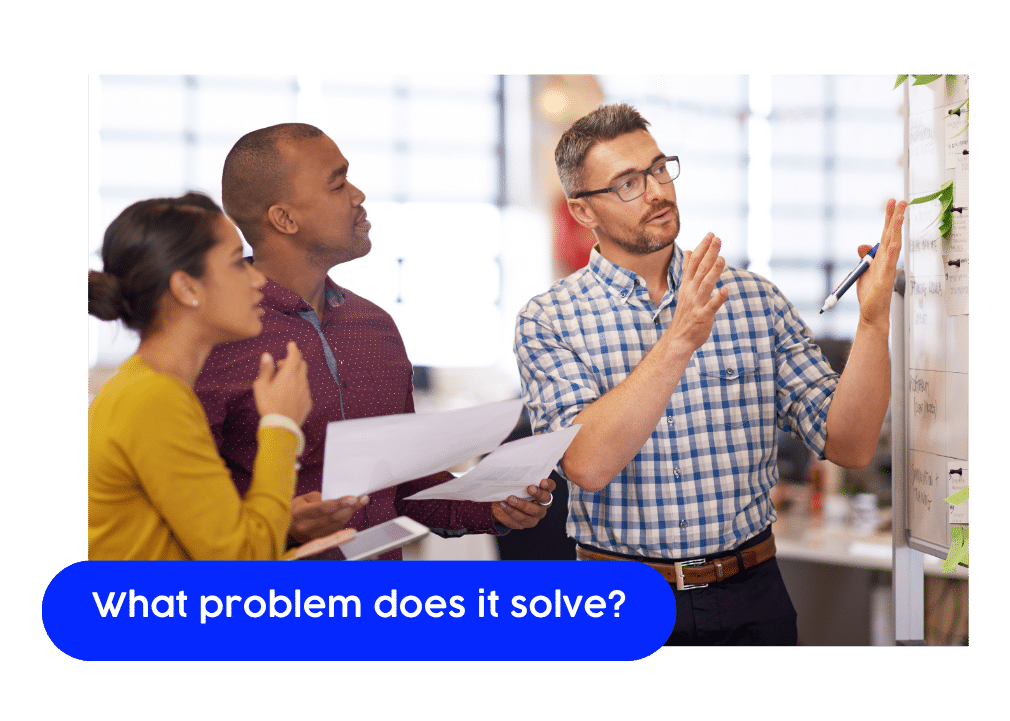 223 » Advent Trinity Marketing Agency Team of three professionals discussing positioning notes in an office, as one man gestures toward a whiteboard covered in sticky notes, with the text overlay: 'What problem does it solve?'