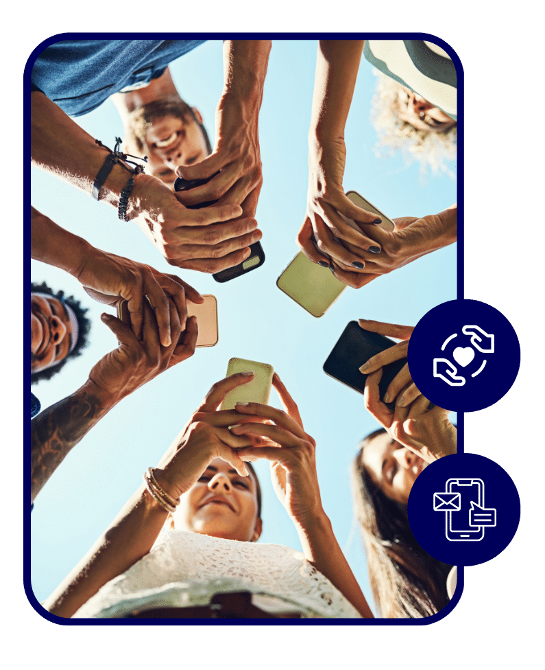 Group of people standing in a circle outdoors holding smartphones together, viewed from below against a bright sky.