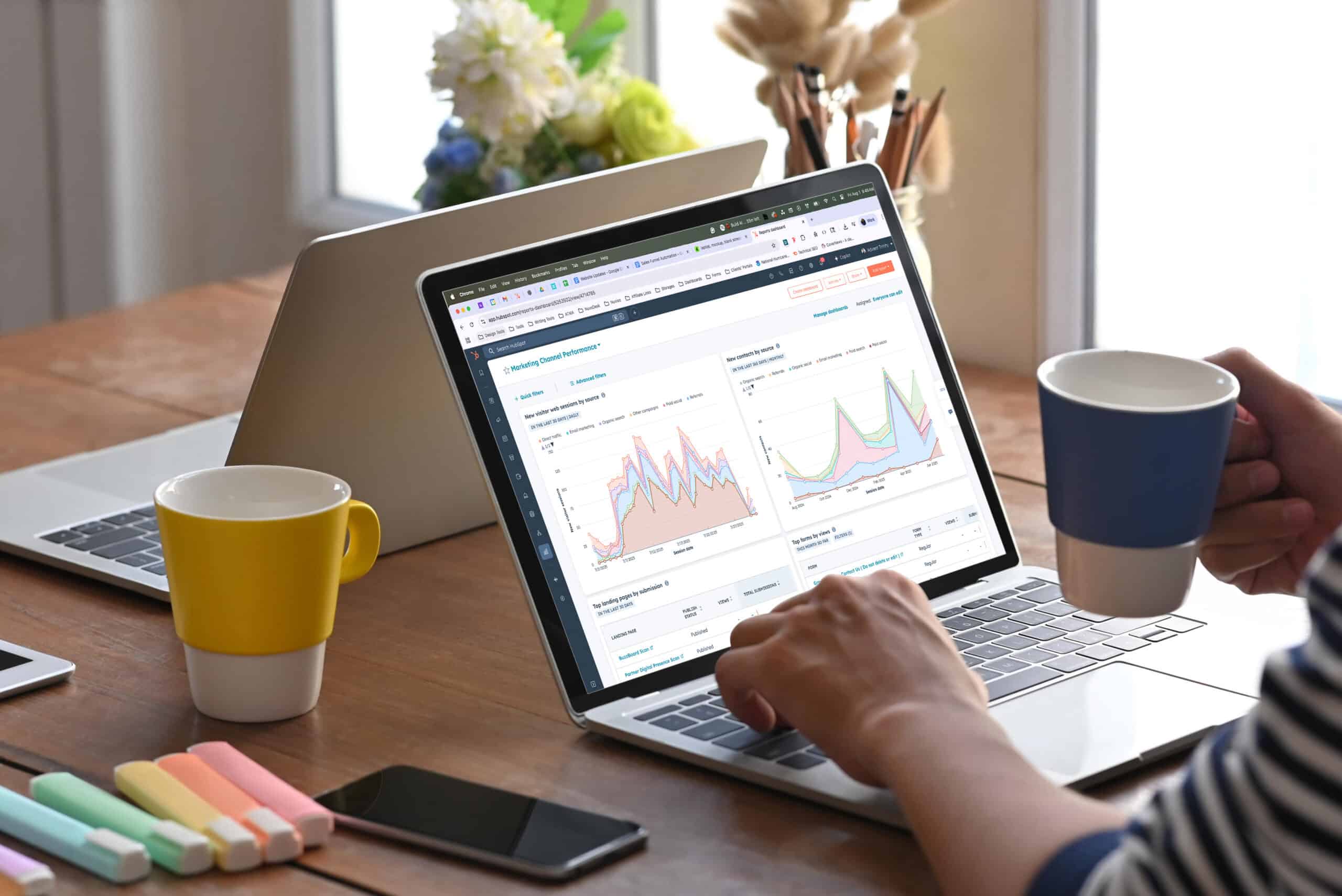 Laptop screen showing marketing channel performance in HubSpot