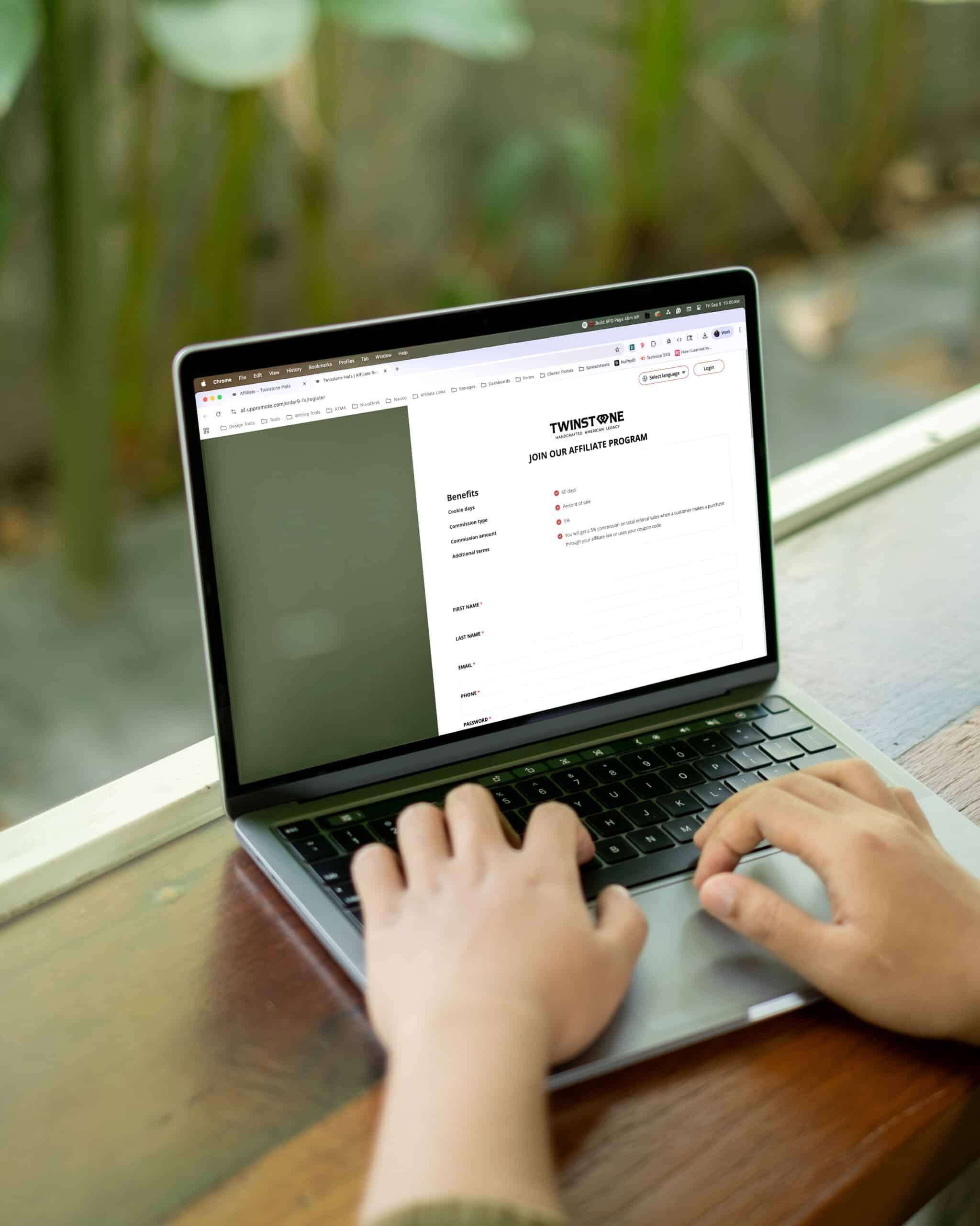 Laptop screen showing Twinstone affiliate sign-up form for strategic partnership development